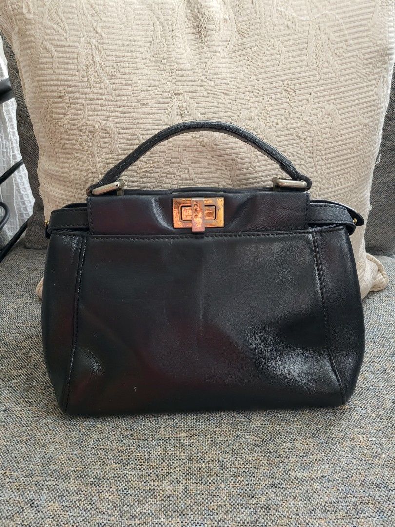 Mini Fendi Peekaboo Bag (Category: Luxury Bags & Wallets) located in Cebu City. Submitted by purseandshoeaddictcebu (Listing ID 1265924389, Image 1). Description: Mini Fendi Peekaboo Bag Genuine Leather Project Bag Hardware needs polishing Handle rubber lining needs repair Overall leather is still in good conditiob LAST PRICE POSTED would not go below Php4000 With code and holo Self Authenticate bought from a Japan seller RFS: Decluttering.