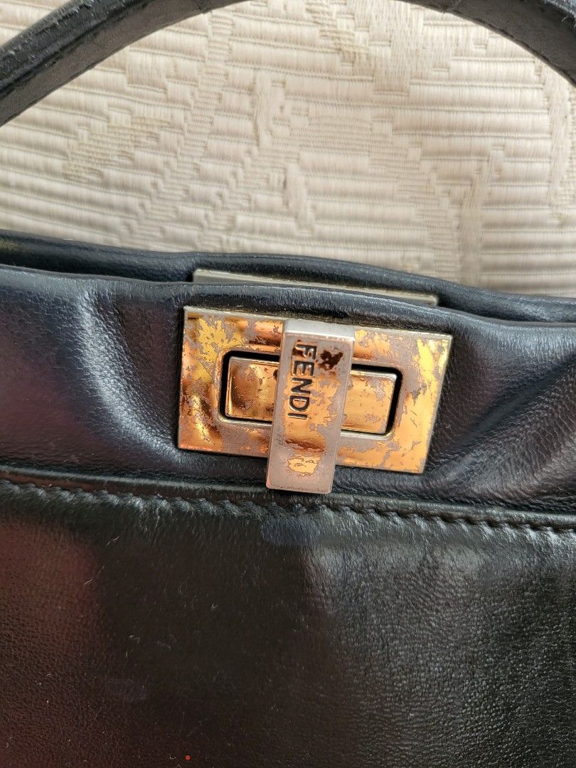 Mini Fendi Peekaboo Bag (Category: Luxury Bags & Wallets) located in Cebu City. Submitted by purseandshoeaddictcebu (Listing ID 1265924389, Image 2). Description: Mini Fendi Peekaboo Bag Genuine Leather Project Bag Hardware needs polishing Handle rubber lining needs repair Overall leather is still in good conditiob LAST PRICE POSTED would not go below Php4000 With code and holo Self Authenticate bought from a Japan seller RFS: Decluttering.