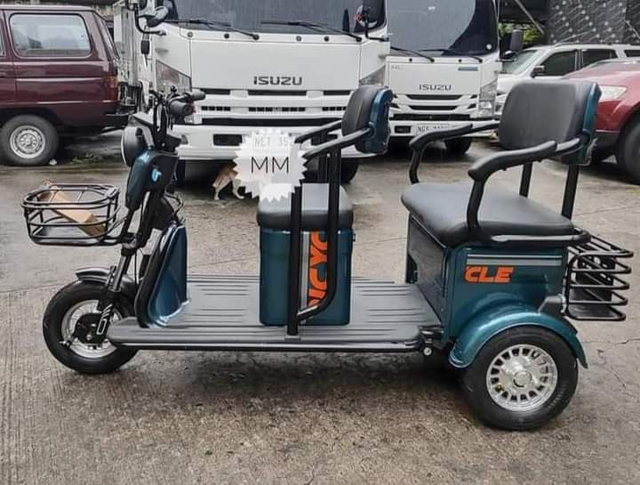 super fashion ebike (Category: Bicycles) located in Manila. Submitted by saguittarian06 (Listing ID 1265998939, Image 1). Description: Super FASHION ebike 3 wheels,2 rows with ROOF! INCLUSIONS: Unit with complete accessories Side mirror with trapal automatic wiper Colors avail Black in Glossy Violet Gray Blue green Specs. With wiper With panel With anti theft alarm 3 seater Front & Back Basket Battery Lead Acid 48v 20AH 650Watts 40-50Km Range 40-