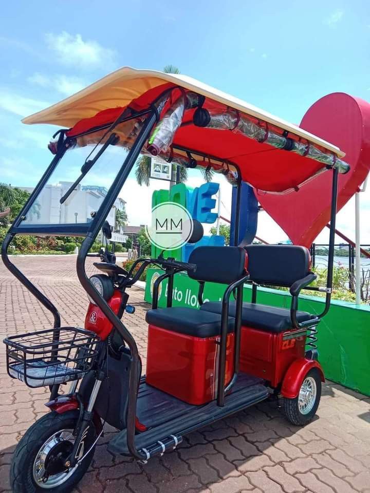 super fashion ebike (Category: Bicycles) located in Manila. Submitted by saguittarian06 (Listing ID 1265998939, Image 2). Description: Super FASHION ebike 3 wheels,2 rows with ROOF! INCLUSIONS: Unit with complete accessories Side mirror with trapal automatic wiper Colors avail Black in Glossy Violet Gray Blue green Specs. With wiper With panel With anti theft alarm 3 seater Front & Back Basket Battery Lead Acid 48v 20AH 650Watts 40-50Km Range 40-
