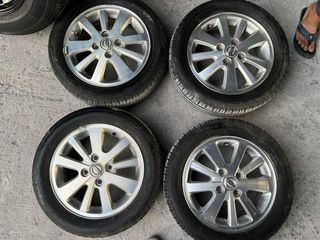 14” Nissan stock used mags 4Holes pcd 100 w/165-60-r14 Bridgestone and dunlop tires