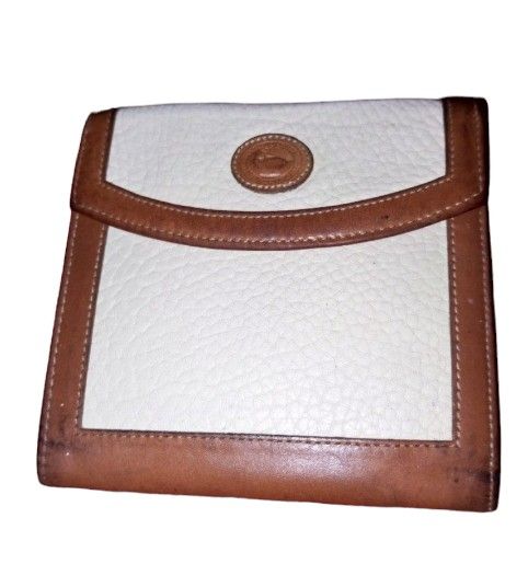 Douney & Bourke bag and wallet (Category: Luxury Bags & Wallets) located in Cavite. Submitted by elmzcloset (Listing ID 1266232438, Image 2). Description: selling set for 3k if sold separately bag is 2500 and wallet is 1500 original item pre-loves with signs of usage. still very presentable in actual. Cream pebbled leather w/ brown leather trim Too zip closure Slightly adjustable strap 10" drop Interior zip pocket and small open pocket key clip G