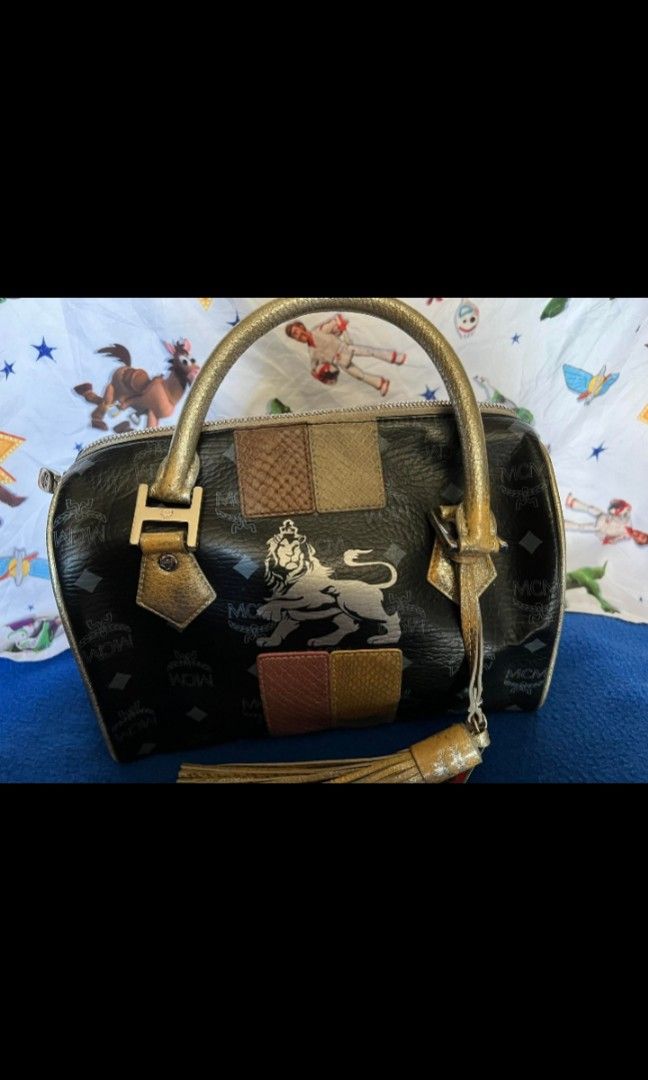MCM Lion series doctors bag with (Category: Luxury Bags & Wallets) located in Quezon City. Submitted by uptrendglam (Listing ID 1266173277, Image 2). Description: MCM lion series vintage small doctors bag , Gamuza inner lining. Original tassel/bag charm included..
