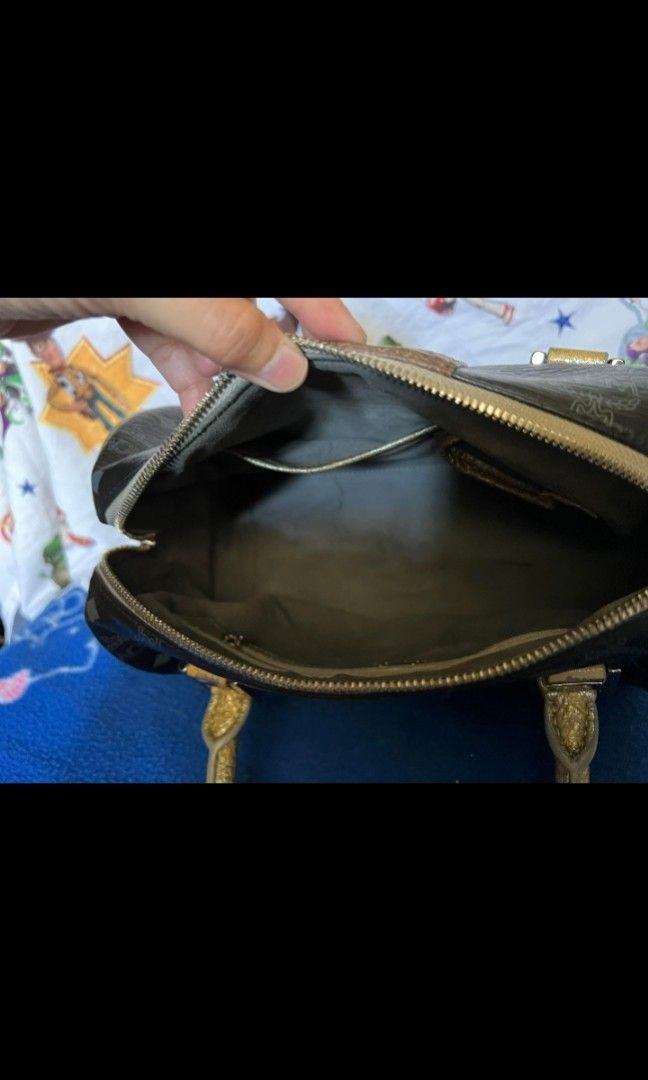 MCM Lion series doctors bag with (Category: Luxury Bags & Wallets) located in Quezon City. Submitted by uptrendglam (Listing ID 1266173277, Image 3). Description: MCM lion series vintage small doctors bag , Gamuza inner lining. Original tassel/bag charm included..