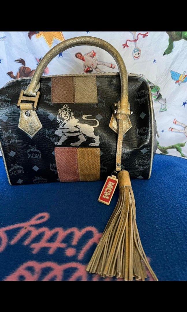 MCM Lion series doctors bag with (Category: Luxury Bags & Wallets) located in Quezon City. Submitted by uptrendglam (Listing ID 1266173277, Image 1). Description: MCM lion series vintage small doctors bag , Gamuza inner lining. Original tassel/bag charm included..