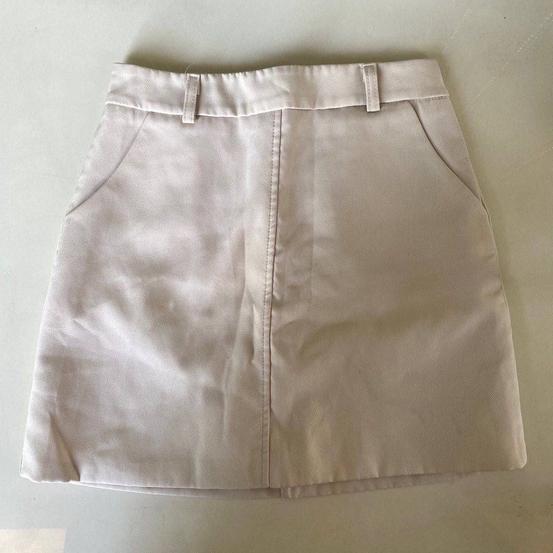 Beige pencil skirt (Category: Skirts) located in Valenzuela. Submitted by mikaaaami (Listing ID 1266270596, Image 1). Description: ☆ no issues ☆ brand new ☆ fits sizes S-L.