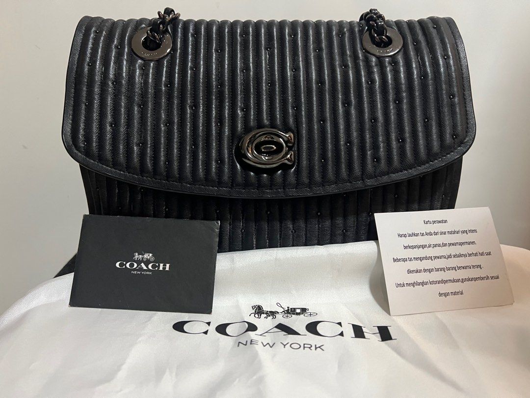 Coach parker with shop quilting and rivets black
