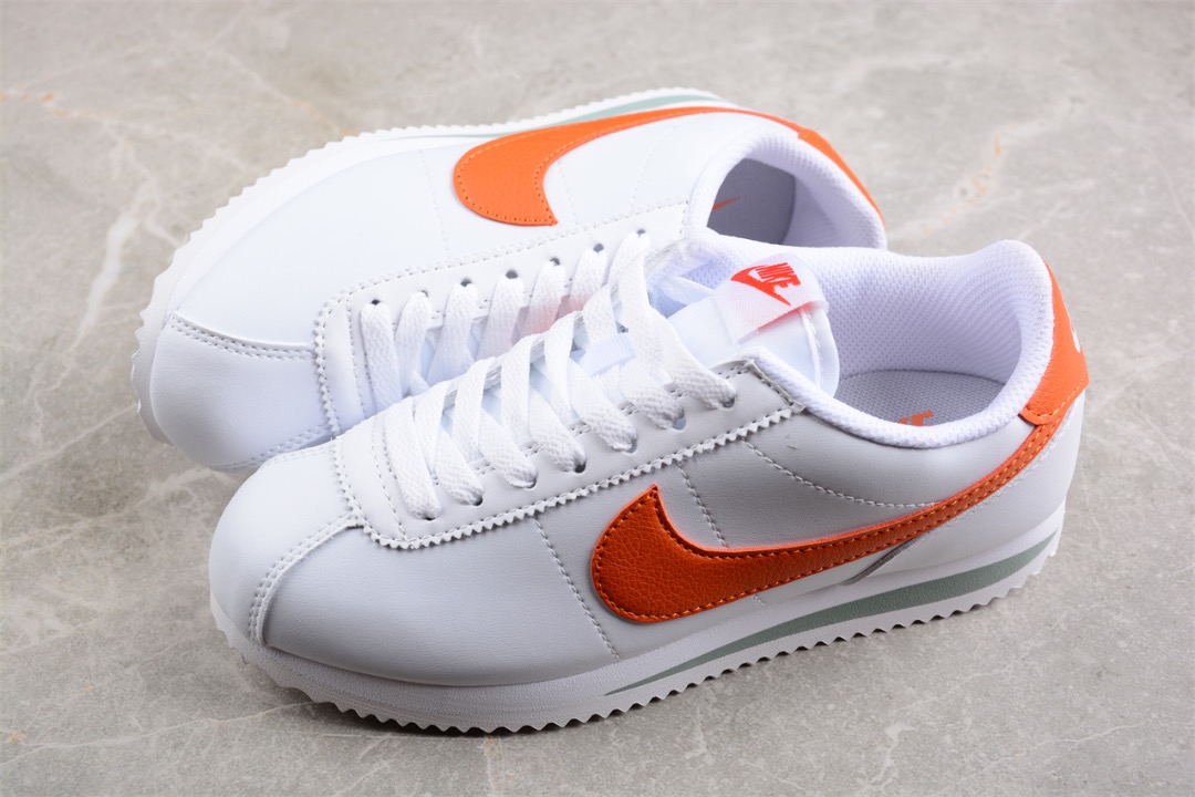 Nike cortez orange white top