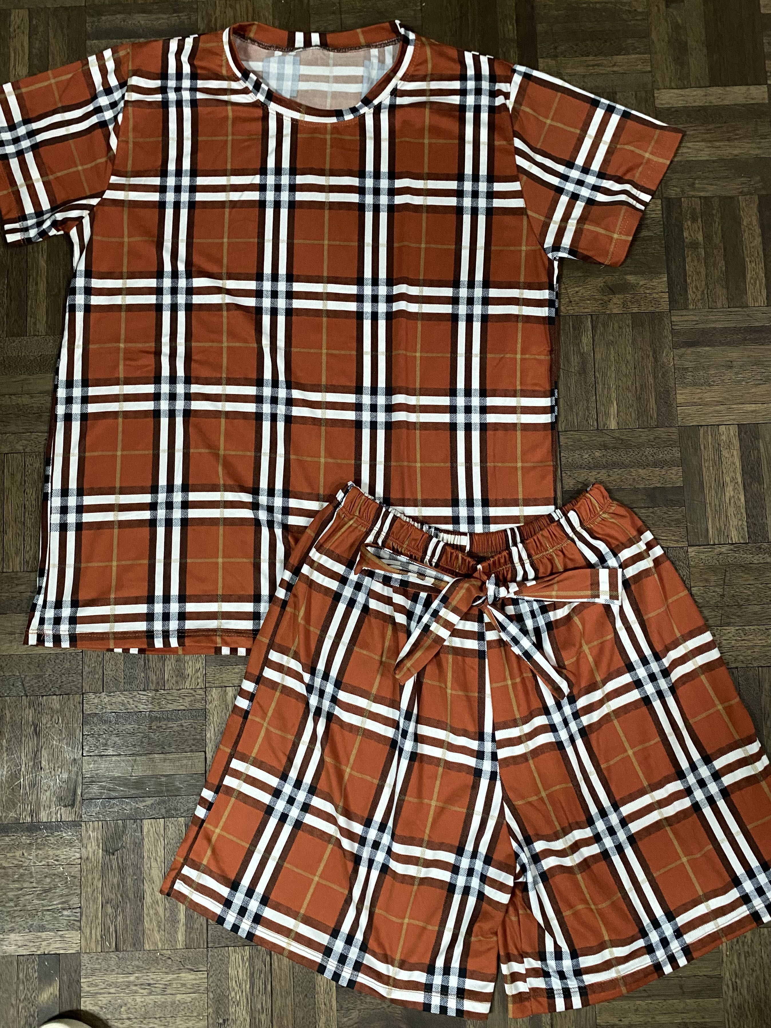 Checkered Plaid Tshirt and Tie Shorts Coordinates Set (Category: Sets or Coordinates) located in Malabon City. Submitted by clo_set (Listing ID 1266606785, Image 1). Description: - Brand New - Stretchable and Shorts have a Garterized Waistband - Fits a Medium to Large.