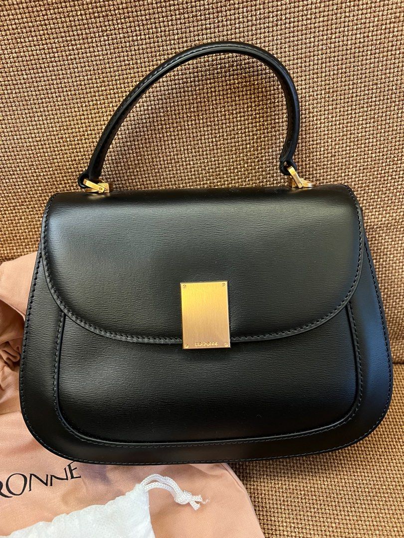Couronne Handbag (Category: Luxury Bags & Wallets) located in Pasay City. Submitted by netuy (Listing ID 1266479029, Image 2). Description: Famous Korean brand used in a lot of k-dramas & by k-pops Curved square shape Embossed plain leather Short top handle Signature metal logo on the flap Adjustable strap Rose gold-tone hardware Magnetic closure Zipper pocket at interior Cow leather.