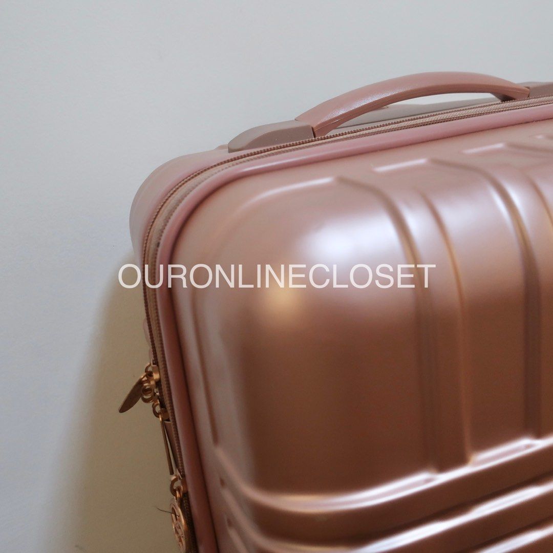 Jessica simpson rose gold luggage 2025