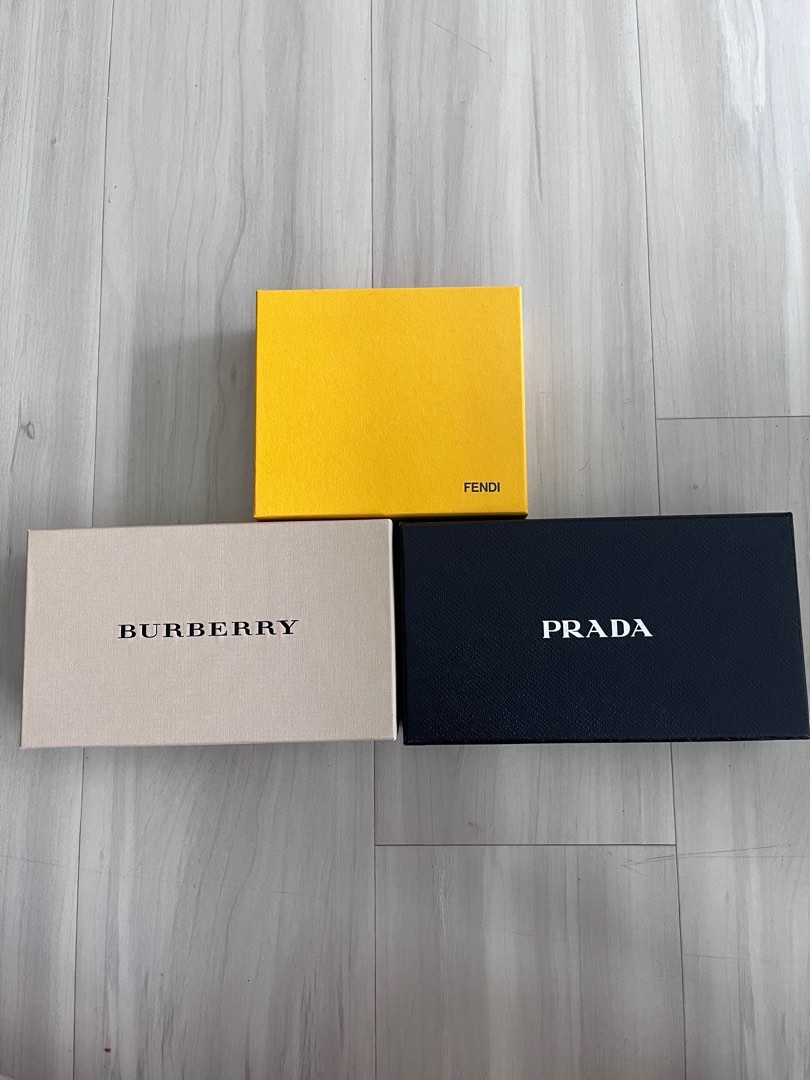 Burberry wallet 2025 vs prada