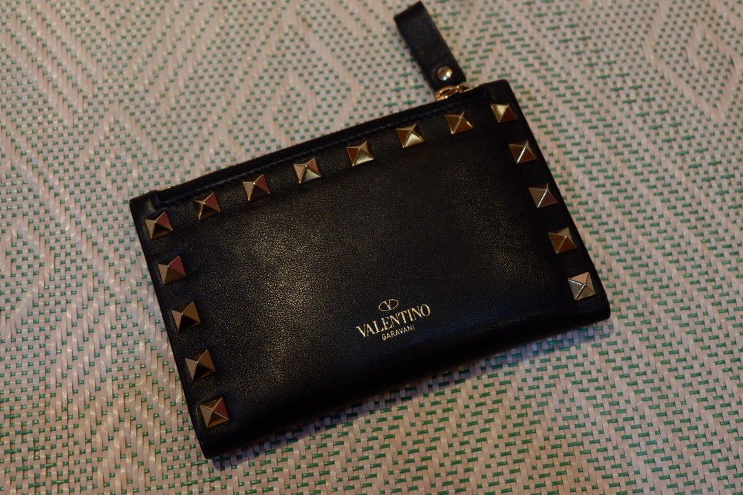 Valentino Garvani Rockstud Cardholder with Zip (Category: Luxury Bags & Wallets) located in Iloilo. Submitted by chringgg (Listing ID 1266546248, Image 2). Description: •near unused GOOD AS NEW 😊— no cracks, no tarnishes • store bought •inclusions: box, dustbag and card •six card slots and two slip pockets •dimensions: W13xH8xD1 cm / W5.1xH3.1xD0.3 in. •currently $545!! selling only 14k + 150 sf Product code: 3W2P0605VBL_0NO LAYAWAY OK!! :> msg 