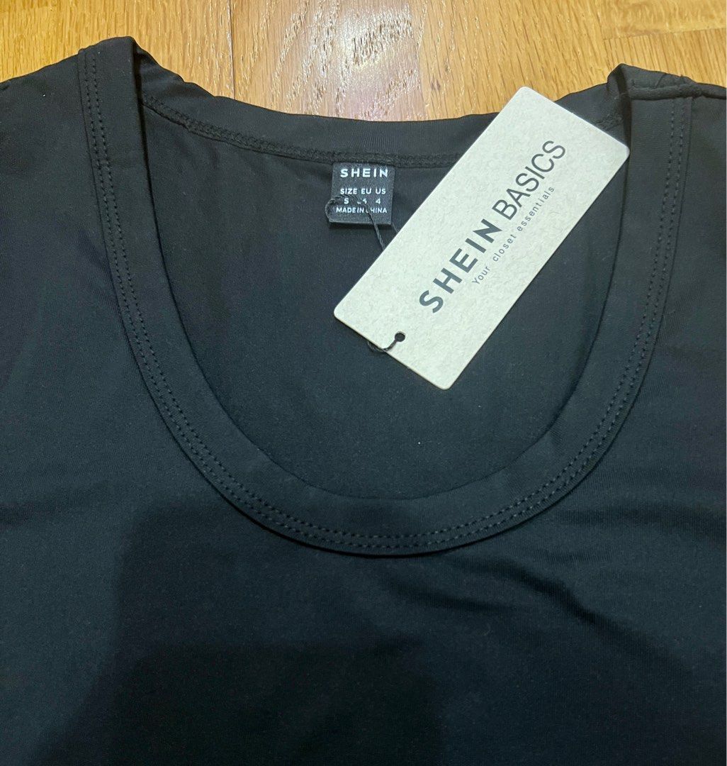 Black Form fitting Tshirt (Category: Shirts) located in Muntinlupa City. Submitted by copcor (Listing ID 1263436497, Image 2). Description: BNWT Nice clingy sexy Black ladies round neck Short sleeves Tshirt Selling low.