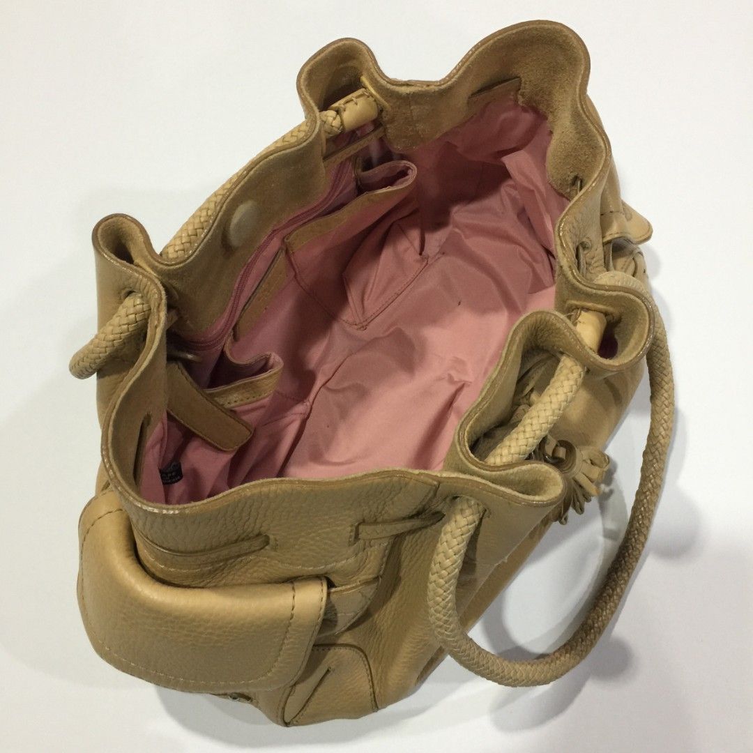 COLE HAAN Leather Braid Handle Bag (Category: Luxury Bags & Wallets) located in Quezon City. Submitted by pleasehelpmedeclutter (Listing ID 1263524043, Image 3). Description: • authentic • no inclusion • preloved (please manage your expectations) • open for meetup (faster and safer transaction).