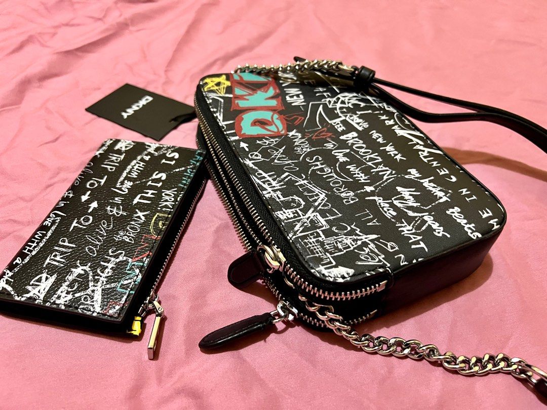 DKNY Camera Double Zip Bag (bag only) (Category: Luxury Bags & Wallets) located in Las Pinas. Submitted by myluckyeight (Listing ID 1263498914, Image 3). Description: Bag only Like New, once lang nagamit Authentic DKNY bag and wallet US bought Graffiti design .