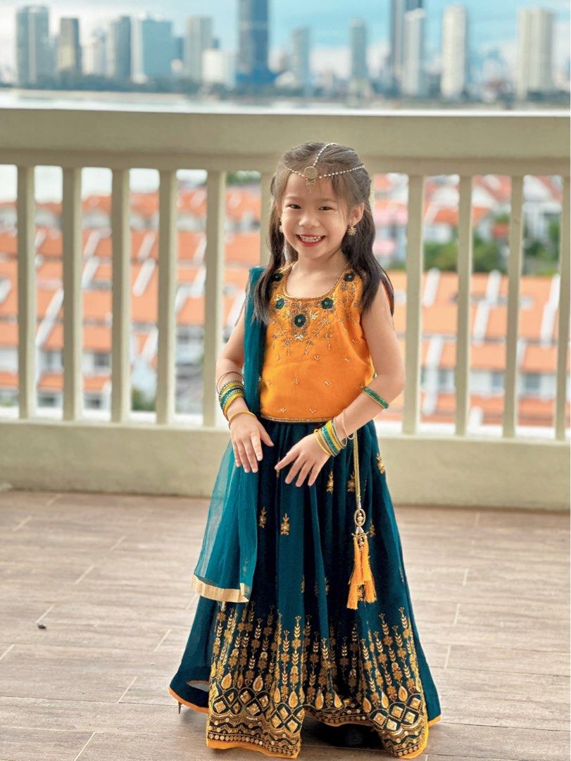 South Indian Cute Girl Kid Wearing Beautiful Traditional Dress Long Skirt  And Blouse,walking Through Village Way With Greenery Background. Stock  Photo, Picture and Royalty Free Image. Image 169103291.