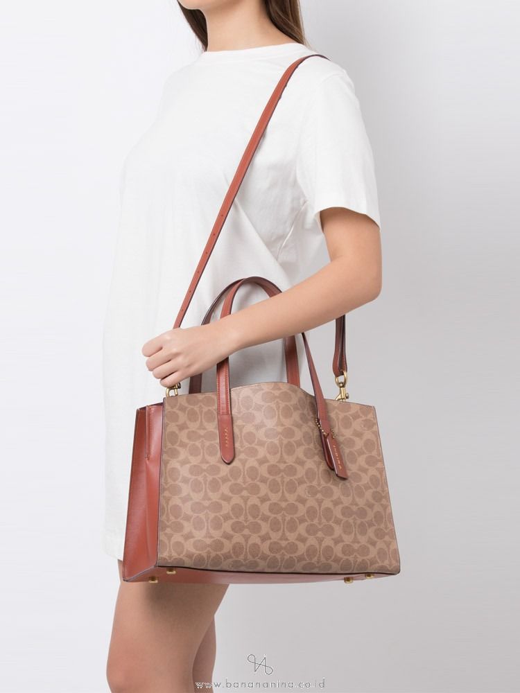 Coach charlie carryall in signature leather top