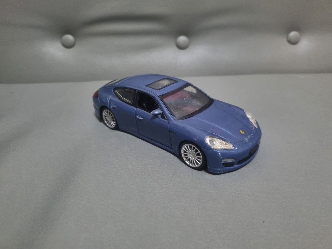 Porsche Panamera by Petron 1:32 (Category: Vehicle & Diecast Models) located in Silang. Submitted by samflores2k4t7 (Listing ID 1263401637, Image 1). Description: For sale Porsche Panamera by Petron Scale 1/32 6 inches lenght Electronic working tested medyo pundido lng d right headlight Issue With paintchip and scratches s may hood at front bumper Crack s windshield see pics No box.