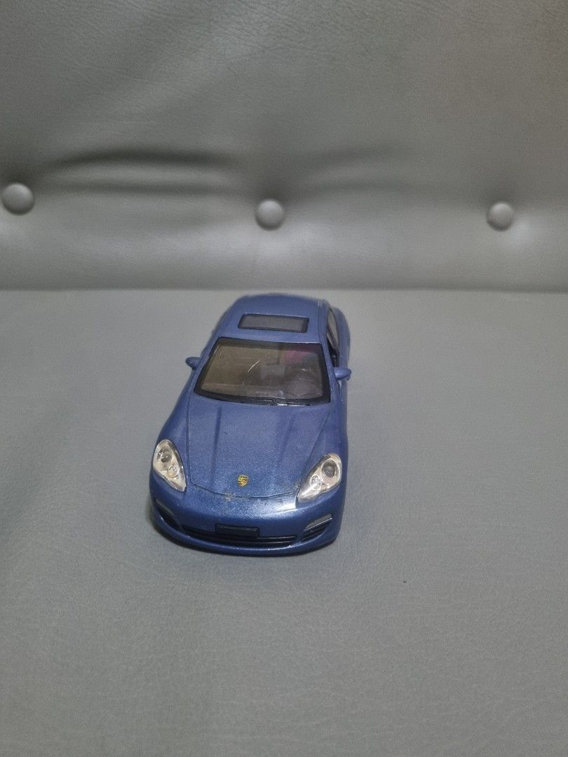 Porsche Panamera by Petron 1:32 (Category: Vehicle & Diecast Models) located in Silang. Submitted by samflores2k4t7 (Listing ID 1263401637, Image 2). Description: For sale Porsche Panamera by Petron Scale 1/32 6 inches lenght Electronic working tested medyo pundido lng d right headlight Issue With paintchip and scratches s may hood at front bumper Crack s windshield see pics No box.
