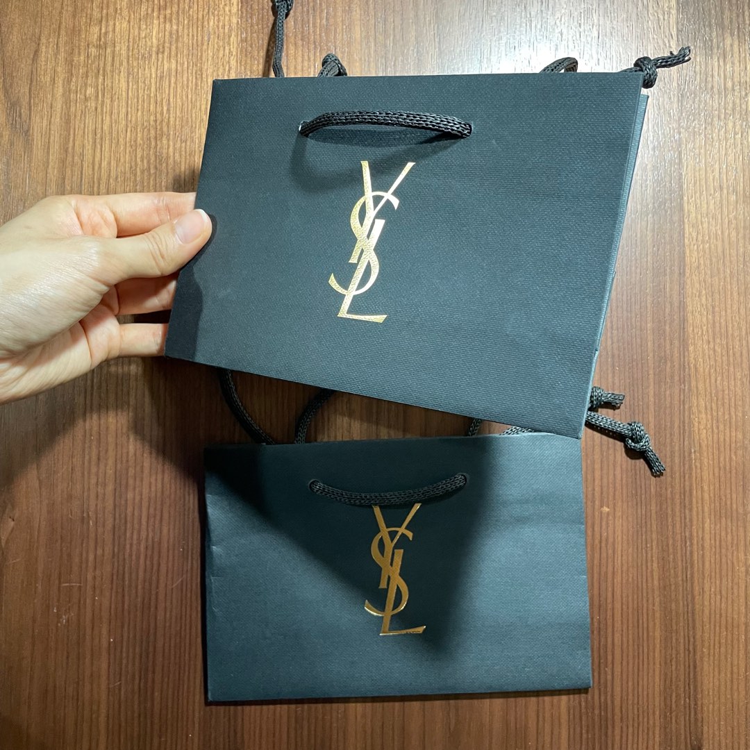YSL black paper bag with gold prints Luxury Bags Wallets on Carousell