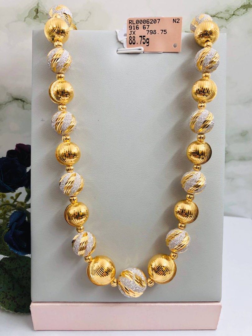Gold shop ball necklace