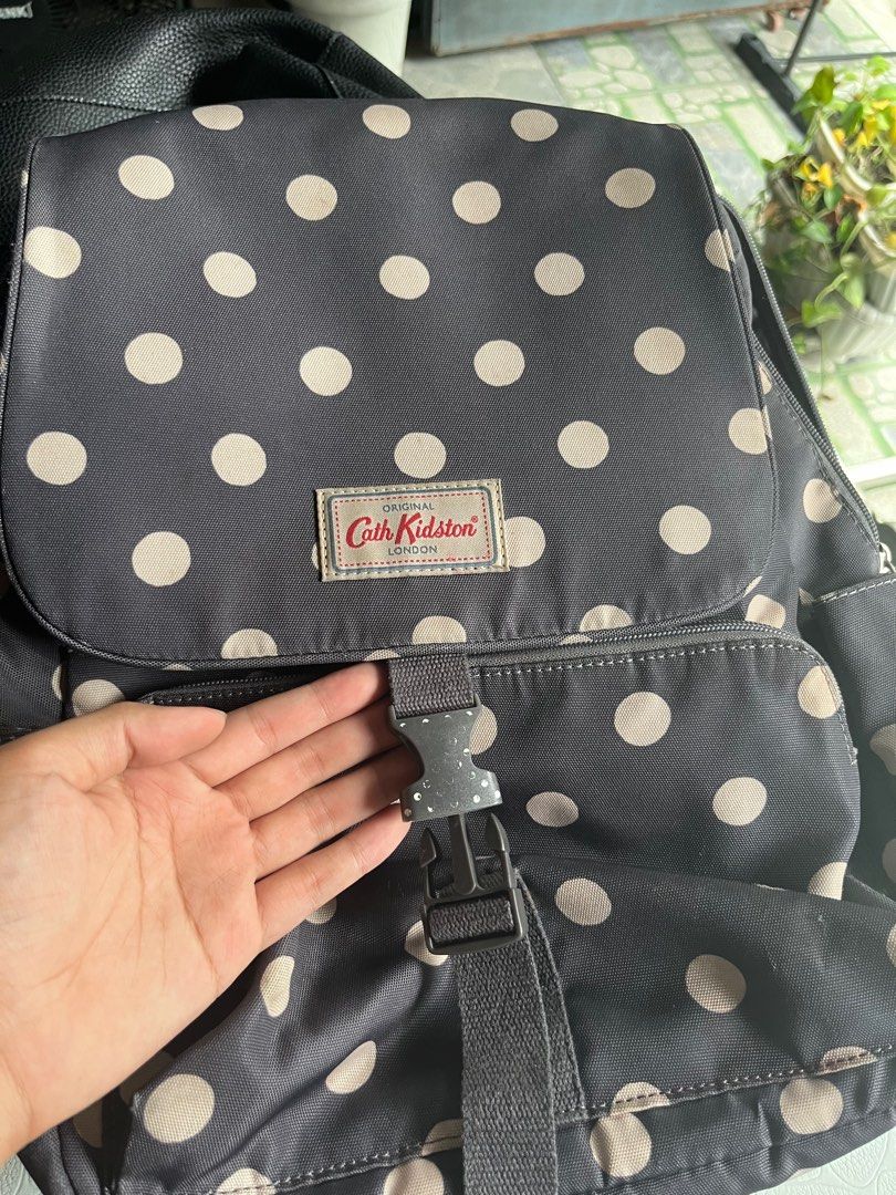 Button spot buckle backpack discount