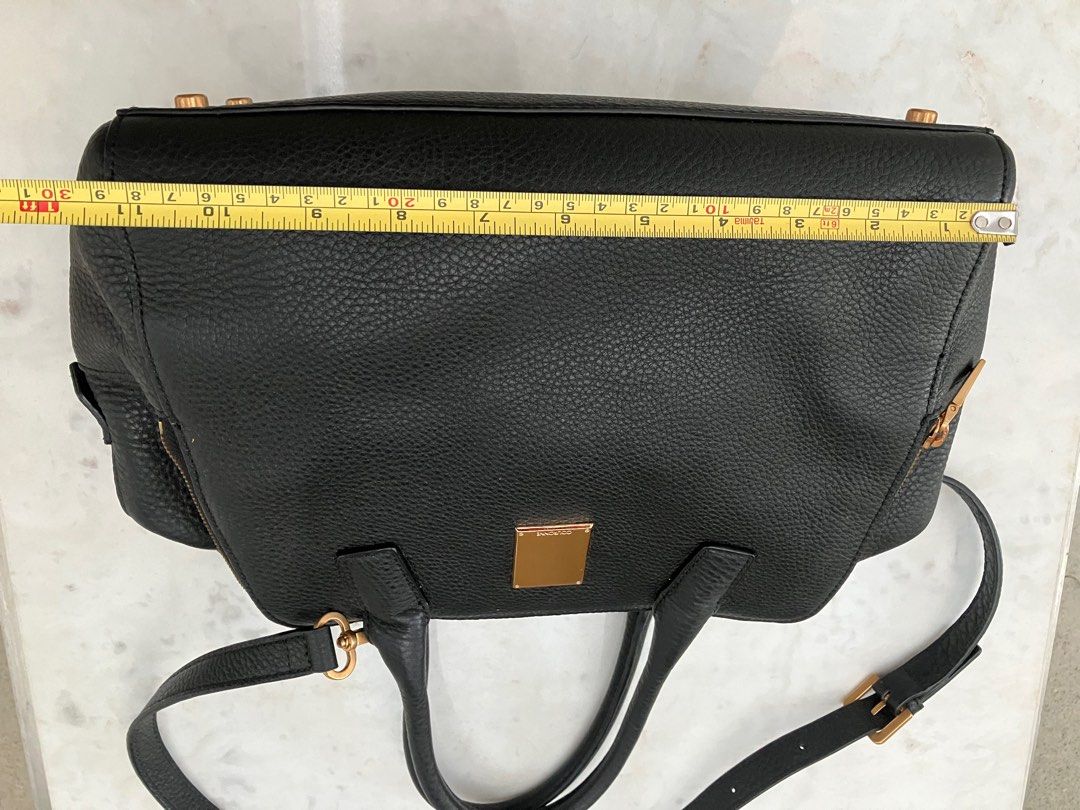 Couronne Black Leather Bowler style bag (Category: Luxury Bags & Wallets) located in Manila. Submitted by zolnak (Listing ID 1266696046, Image 2). Description: Authentic black pebbled leather bowler style bag. Triple zippered compartment with zippered interior pocket and 3 slip pockets inside middle compartment. 10 inch iPad can fit side compartment. Rose gold hardware. With metal feet. With sling strap. Zipper with minimal dark spots. Can be a s