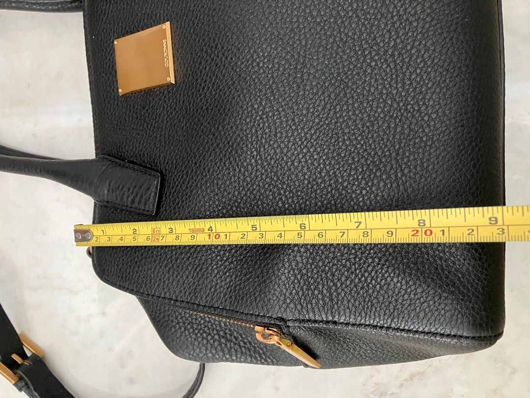 Couronne Black Leather Bowler style bag (Category: Luxury Bags & Wallets) located in Manila. Submitted by zolnak (Listing ID 1266696046, Image 3). Description: Authentic black pebbled leather bowler style bag. Triple zippered compartment with zippered interior pocket and 3 slip pockets inside middle compartment. 10 inch iPad can fit side compartment. Rose gold hardware. With metal feet. With sling strap. Zipper with minimal dark spots. Can be a s