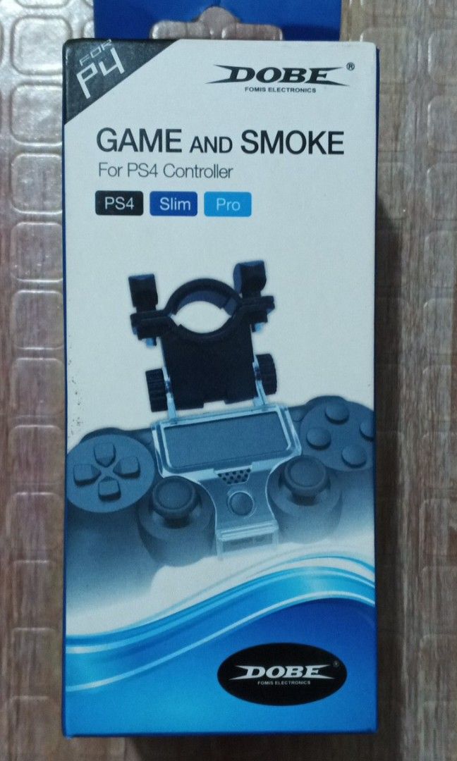 DOBE Game and Smoke (Sealed) (Category: Controllers) located in Valenzuela. Submitted by tasha503 (Listing ID 1266811234, Image 1). Description: DOBE Game and Smoke (Brand New) PS4 Controller Attachment Open for Trade sa PS4 Games Meet Ups: LRT Monumento SM Grand BBB Valenzuela SM Valenzuela Lalamove sa Malapit Gogo / Flash Express sa Malayo MOP: GCash or Cash sa Meet Up.