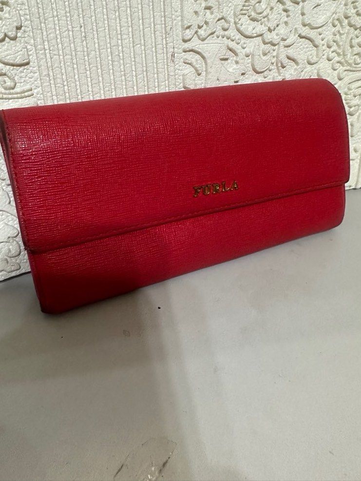 Furla Long Wallet (Category: Luxury Bags & Wallets) located in Manila. Submitted by shopaholic_gurl (Listing ID 1266777225, Image 2). Description: Good condition Red saffiano leather With normal signs of usage on sides Multi card compartment with Internal zipped pocket Normal signs of usage Sold as is .