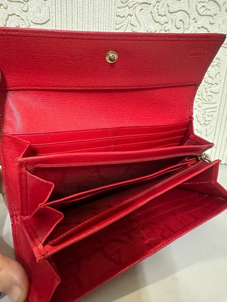 Furla Long Wallet (Category: Luxury Bags & Wallets) located in Manila. Submitted by shopaholic_gurl (Listing ID 1266777225, Image 3). Description: Good condition Red saffiano leather With normal signs of usage on sides Multi card compartment with Internal zipped pocket Normal signs of usage Sold as is .