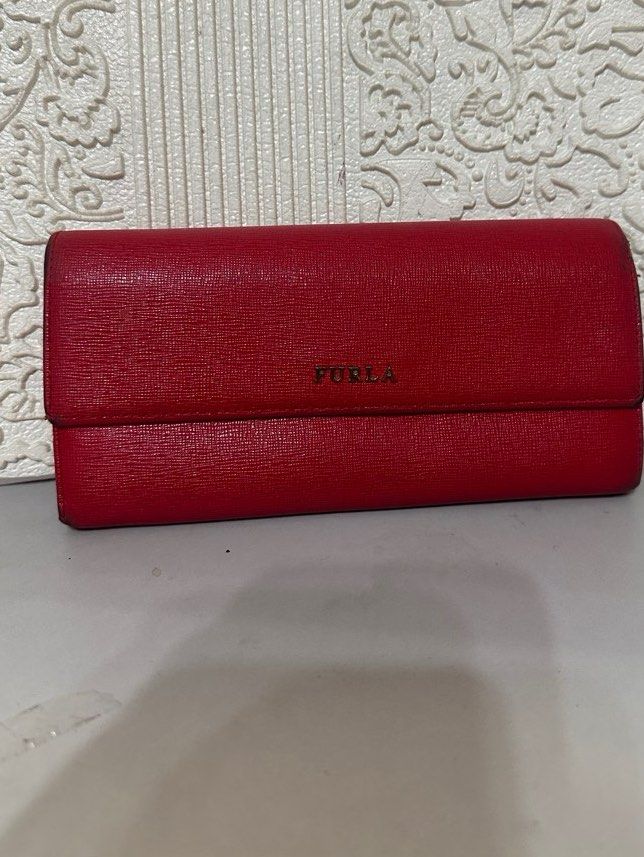 Furla Long Wallet (Category: Luxury Bags & Wallets) located in Manila. Submitted by shopaholic_gurl (Listing ID 1266777225, Image 1). Description: Good condition Red saffiano leather With normal signs of usage on sides Multi card compartment with Internal zipped pocket Normal signs of usage Sold as is .