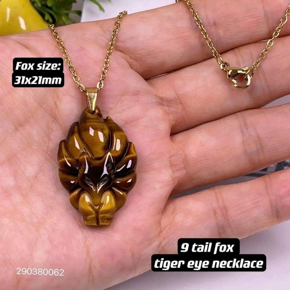 Nine tailed fox tiger eye necklace (Category: Necklaces) located in Manila. Submitted by luckycharmsonlineshopping_ (Listing ID 1266731880, Image 1). Description: New new new 💥💥💥 🌈9 tailed fox tigers eye stainless necklace🌈 ✅authentic tigers eye, stainless necklace chain , pendant holder : stainless gold ✅size: 👉fox: 21x31mm, 👉necklace chain:18inches (can request size 18-24inches) 💎 Tiger-eye: Stone of discipline,wealth, protection 💎 9-t