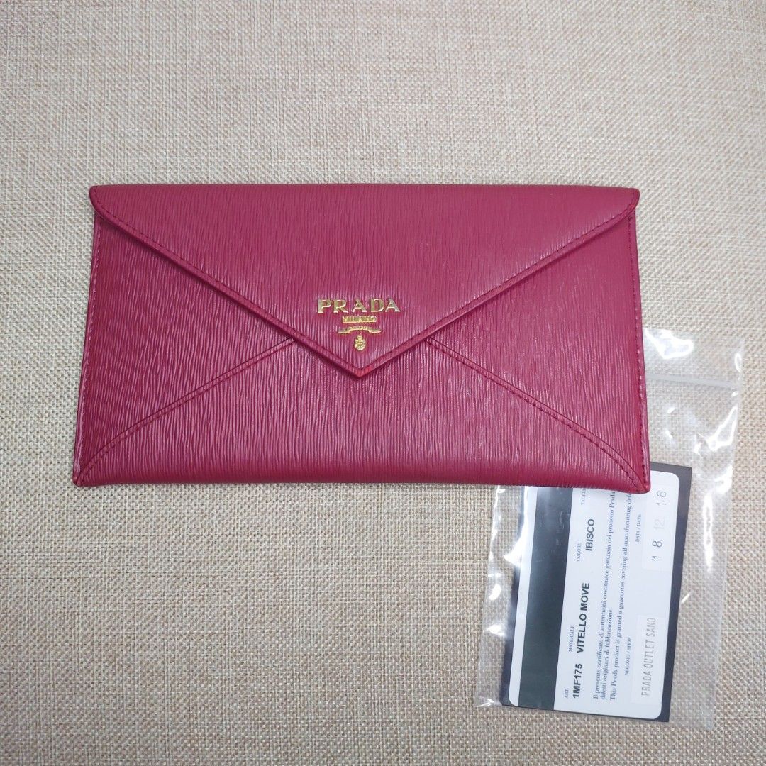 PRADA Vitello Move Envelope Wallet Ibisco RUSH SALE (Category: Luxury Bags & Wallets) located in Imus. Submitted by impulsiveshopperjen (Listing ID 1266725446, Image 2). Description: 🚩 bought in Prada Sano Outlet Japan | originally bought for Php , ⚠️ still in good condition but with minor scuffs on edges and inside stain( see pics for your reference) ♻ RFS: decluttering 📍 Inclusions: Box, card and receipt 📏 ☞ 📸 NOTE: Color may vary in actual