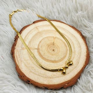 Authentic Nina Ricci 22KT Gold Plated Ribbon Bow Pendant Choker Necklace