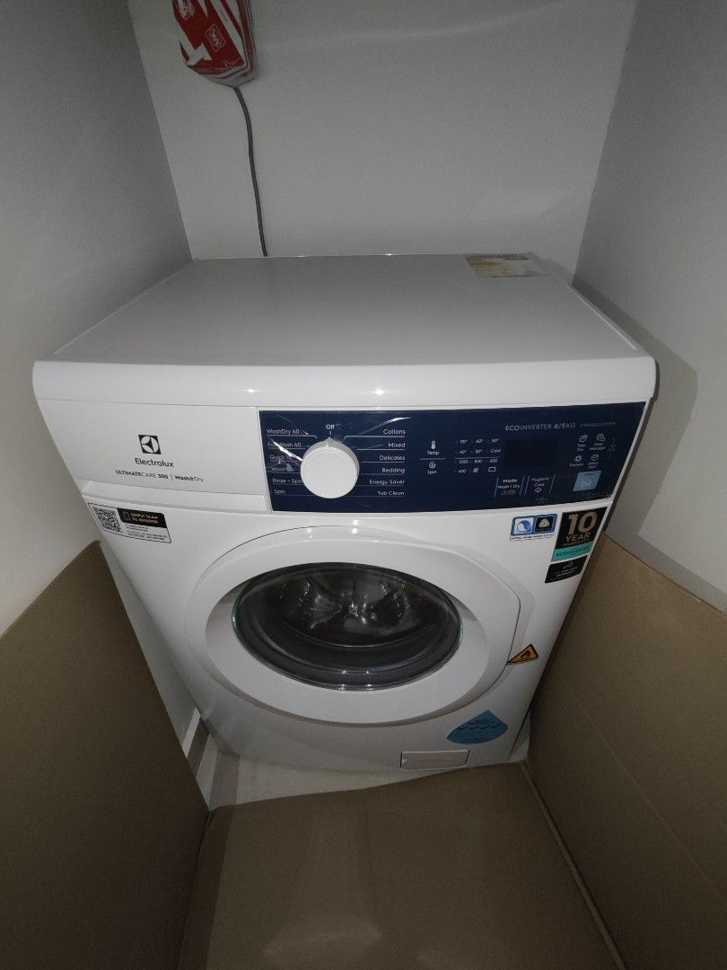 Brand New Electrolux care 300 wash and dry machine, TV & Home
