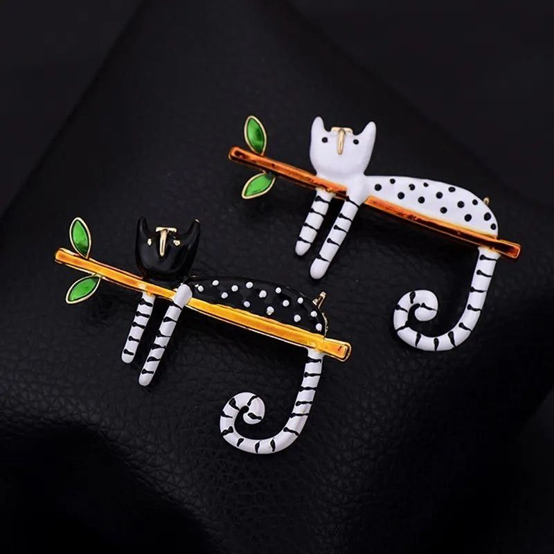 Cat brooches and top pins