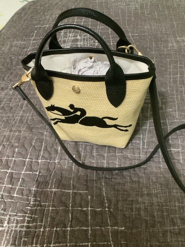 Long Champ (Category: Luxury Bags & Wallets) located in Dagupan City. Submitted by strapsandstripes (Listing ID 1266972309, Image 1). Description: Le Pliage Paris-Saint-Tropez Bucket Bag Black Canvas.