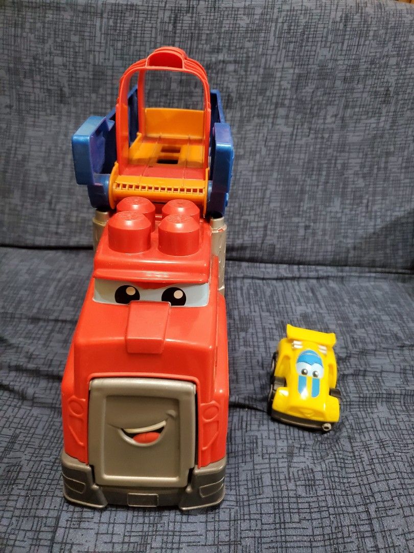 Megablocks truck with car (Category: Lego & Building Sets) located in Taytay. Submitted by xismart (Listing ID 1266870684, Image 2). Description: Megablock truck with car. truck can transform into a track. selling low. loved by my son pero he outgrew it na. still in very good condition. missing 2 pieces of blocks but will not affect the function of the truck and car. just a bit dusty. will clean it when you buy it. bought it from Canada. 1st user