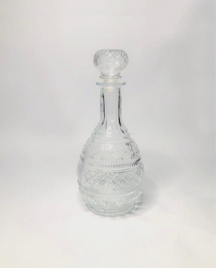 Art Deco Glass Decanter (Category: Pitchers & Dispensers) located in Quezon City. Submitted by closingtime (Listing ID 1267115671, Image 1). Description: Heavy pressed glass decanter with airtight bottle stopper Can hold up to 1000mL Condition: Very good, light vintage wear Dimensions: 27 cm H, 15 cm widest point.