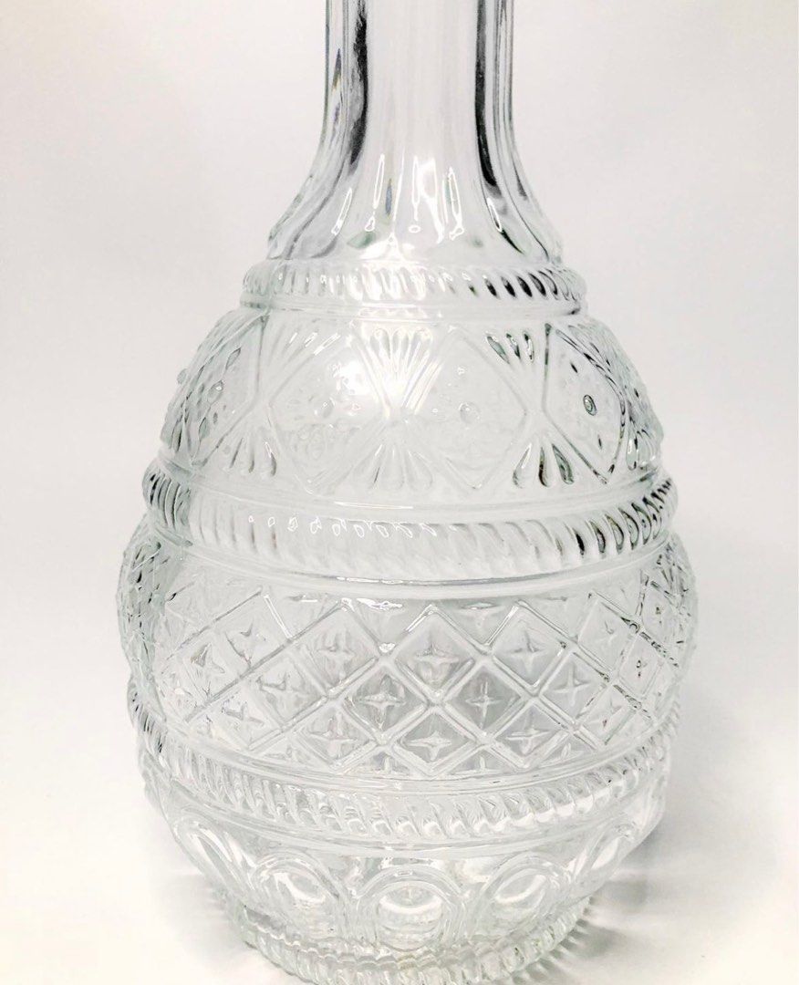 Art Deco Glass Decanter (Category: Pitchers & Dispensers) located in Quezon City. Submitted by closingtime (Listing ID 1267115671, Image 2). Description: Heavy pressed glass decanter with airtight bottle stopper Can hold up to 1000mL Condition: Very good, light vintage wear Dimensions: 27 cm H, 15 cm widest point.
