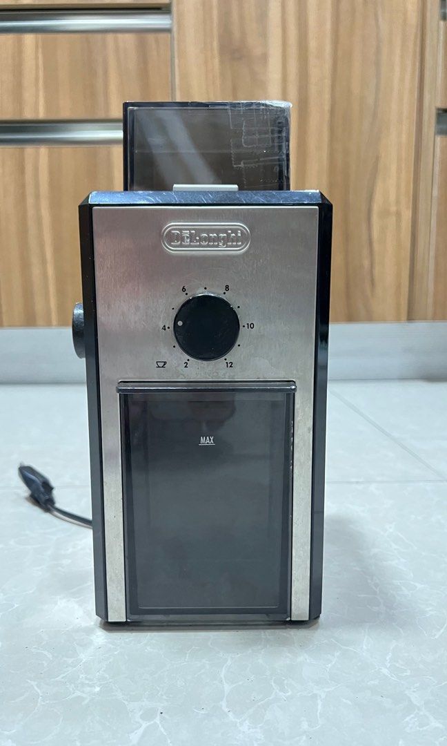 Delonghi coffee grinder with box (Category: Coffee Machines & Makers) located in Pasig City. Submitted by ktnlm (Listing ID 1267048549, Image 1). Description: Original Delonghi coffee grinder With crack as seen on photo but fully functional Comes with box MOP: BPI/BDO/GCash Shipping c/o buyer.