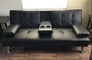 Sofa bed with cup holder in black leather cover