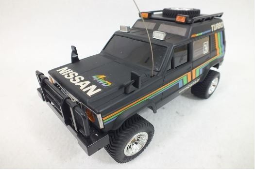 Vintage Yonezawa Nissan Safari Black 4x4 RC truck with box