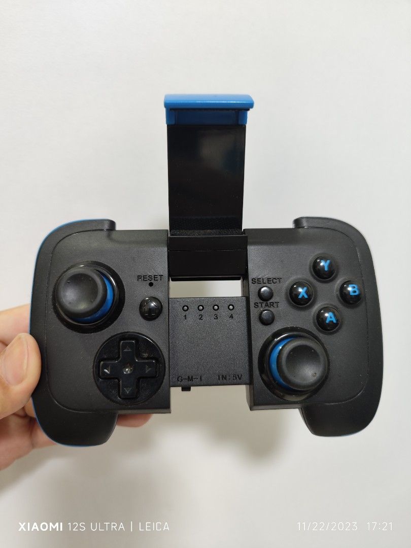 Wireless controller (Category: Controllers) located in Singapore. Submitted by silencekillers (Listing ID 1267096659, Image 2). Description: Personal item Bought $29.90 Seldom use Just the controller for mobile phone use play game Interested buyer text me Thx.