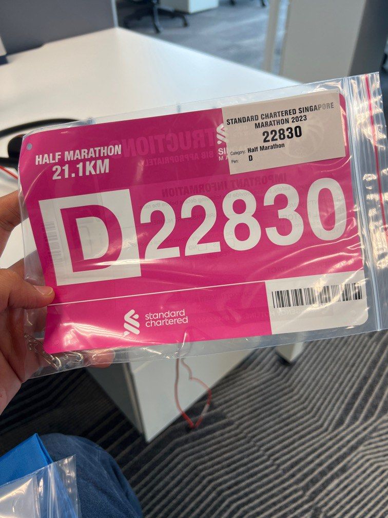 Standard Chartered half marathon (21 kms) bib + running bag deposit