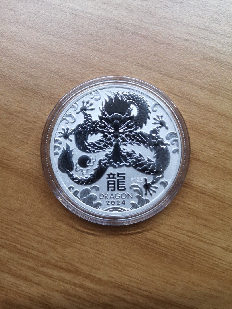 The Perth Mint Dragon Silver 1oz 2024 (Category: Vintage Collectibles) located in Singapore. Submitted by bullionex (Listing ID 1267350330, Image 1). Description: The Perth Mint Dragon Silver 1oz 2024 Remark: 1pc SGD59 2pcs SGD57.50 each 5pcs and above at SGD56 each + free tracking delivery Specifications: - Country: Australia - Manufacturer: Perth Mint - Diameter: 40.9 mm - Thickness: 3.5 mm - Purity: .999 - Weight: 1 troy oz (31.1 gram) - Year 