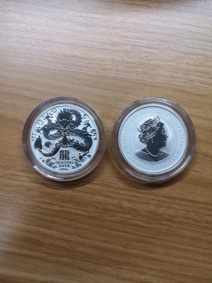 The Perth Mint Dragon Silver 2oz 999.9 fineness (2024) (Category: Vintage Collectibles) located in Singapore. Submitted by bullionex (Listing ID 1267350992, Image 1). Description: The Perth Mint Dragon Silver 2oz 999.9 fineness (2024) Remark: Limited! First come first serve. Specifications: - Country: Australia - Manufacturer: Perth Mint - Diameter: 50.8 mm - Thickness: 4.8 mm - Purity: .999 - Weight: 2 troy oz (62.2 gram) - Year of issuance: 202
