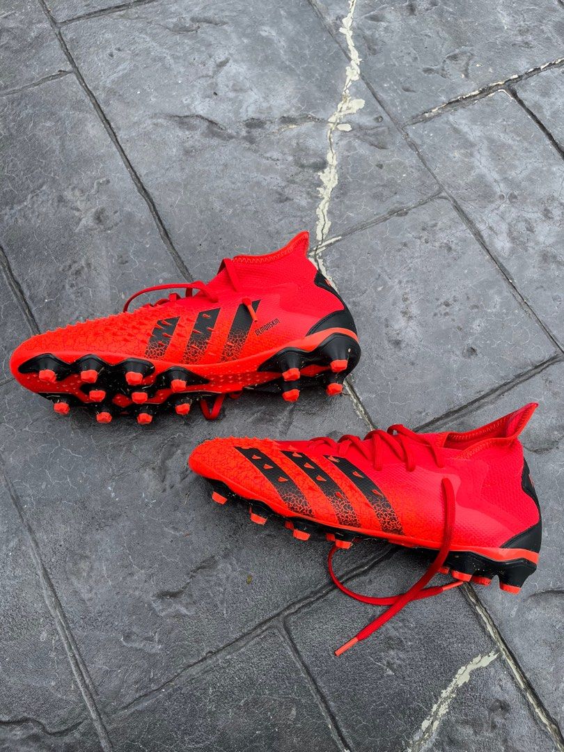 Red predator football boots on sale